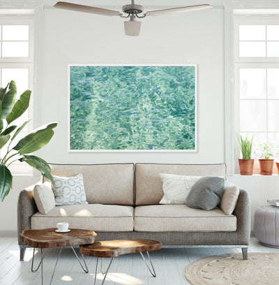 Large abstract art print by Cattie Coyle Photography above couch in living room