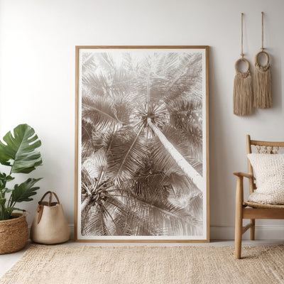 Black and white palm trees art print by Cattie Coyle Photography leaning in living room