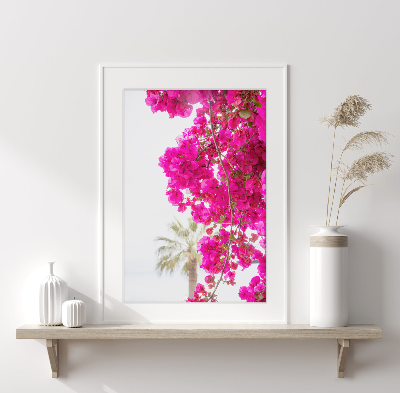 Pink wall art by Cattie Coyle Photography on shelf