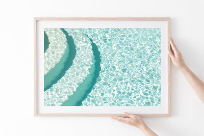 Pool wall art by Cattie Coyle Photography in natural wood frame