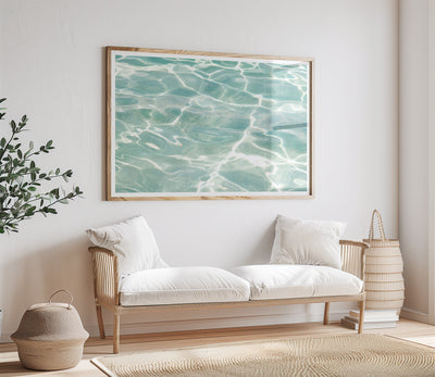 Caribbean Sea No 3 - Turquoise abstract art print by Cattie Coyle Photography above couch.
