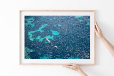 Cote d'Azur – Aerial ocean photography art print by Cattie Coyle in natural wood frame