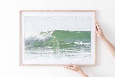 Ocean wave wall art by Cattie Coyle Photography in natural wood frame