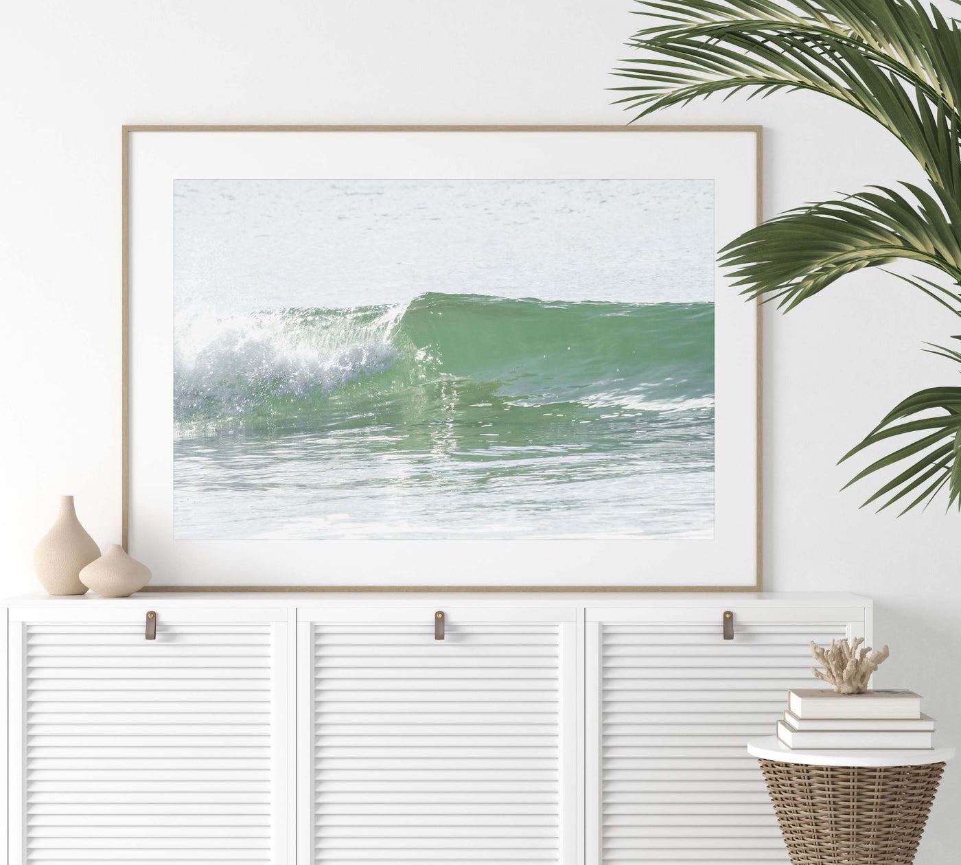 Ocean wave wall art by Cattie Coyle Photography above dresser