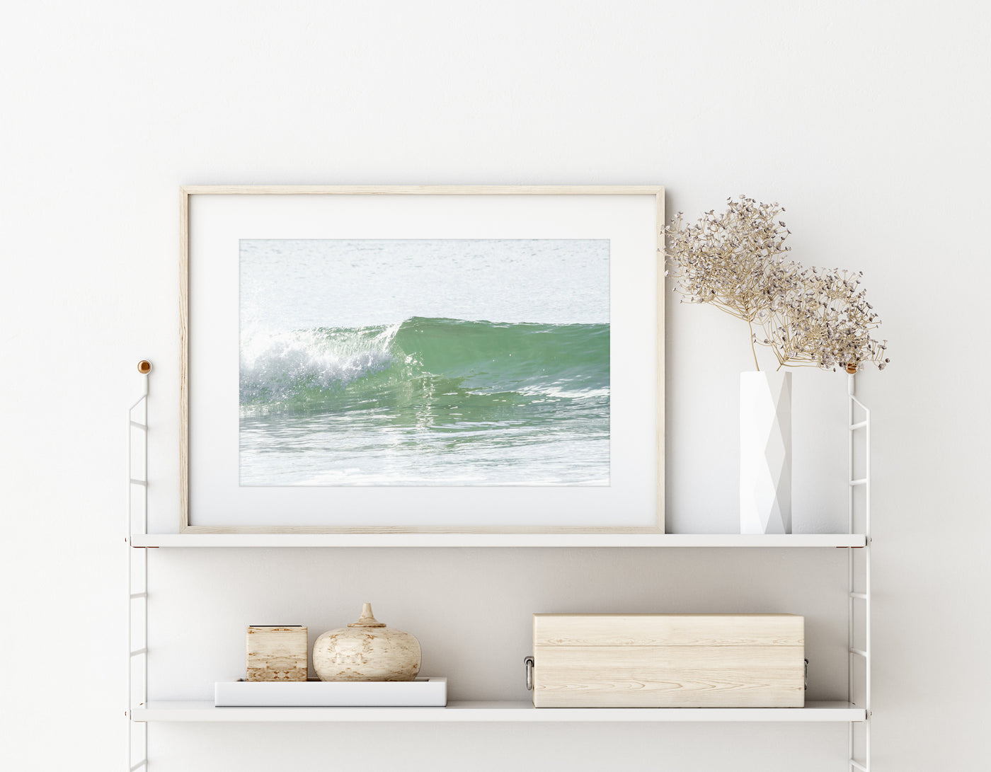 Ocean wave wall art by Cattie Coyle Photography on string shelf