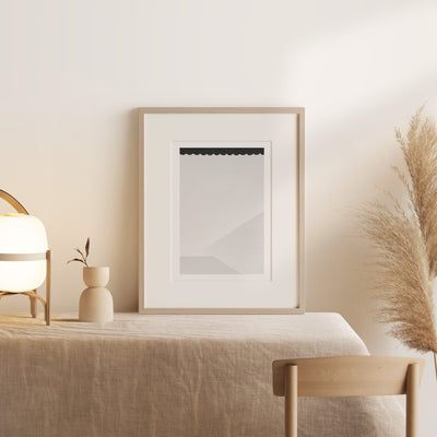 Shadow: White and black abstract art print by Cattie Coyle Photography on table