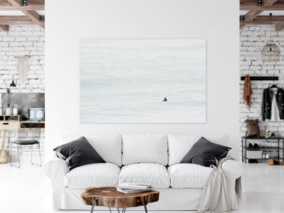 Large surfing acrylic glass print by Cattie Coyle photography above couch
