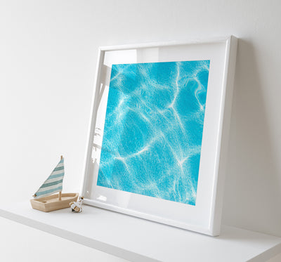 Swimming pool wall decor by Cattie Coyle Photography on shelf