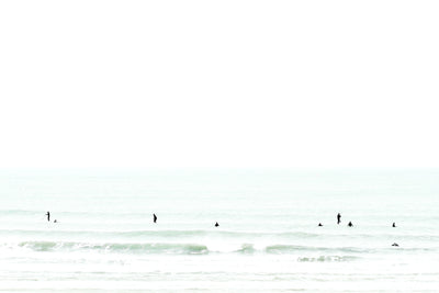 Surfers waiting for a wave - Fine art print by Cattie Coyle Photography